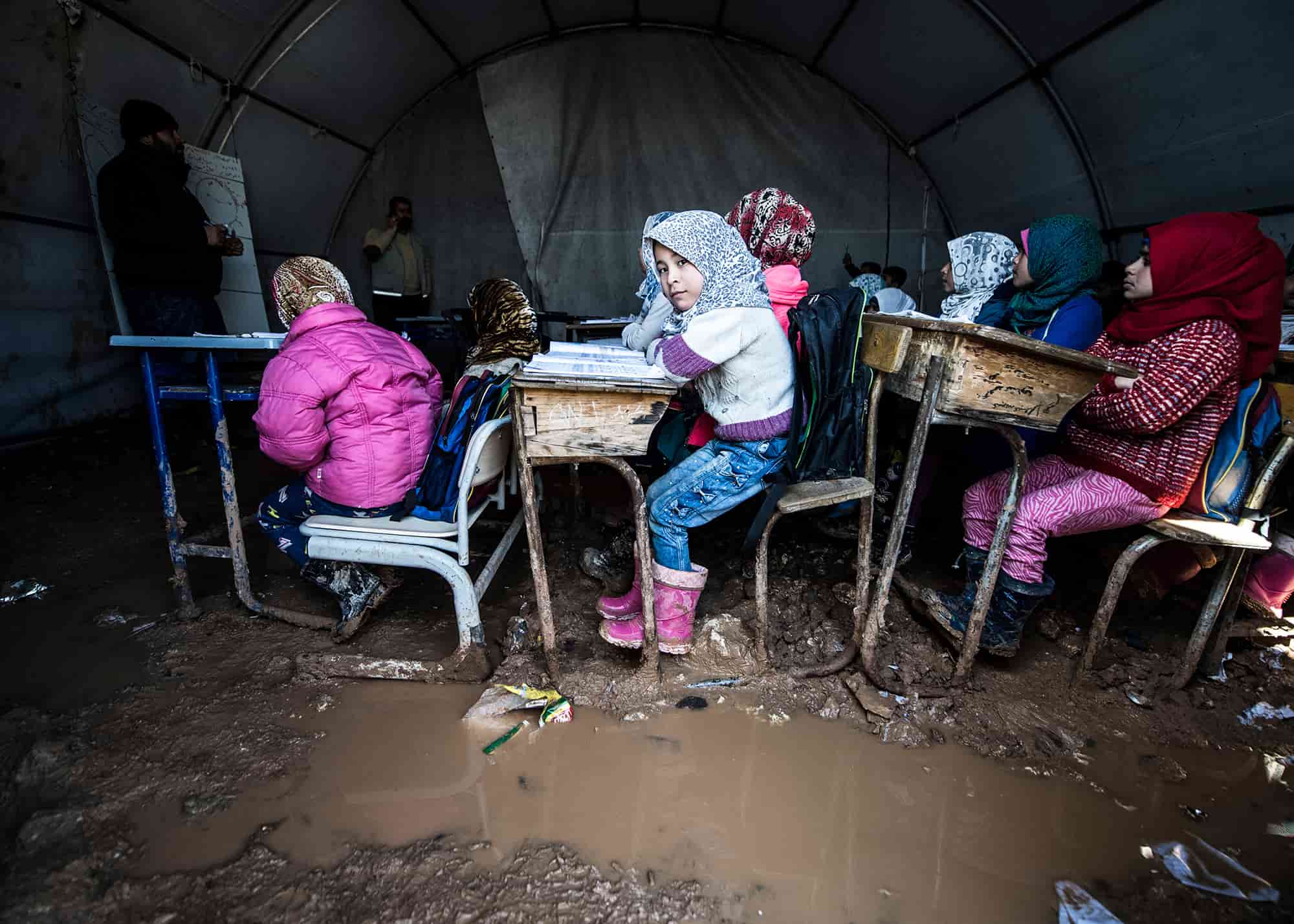 Educational conditions of children in Azez, Syria. They take lessons in tents. places in water and mud. Azez town located on the border of Turkey and Syria. 25 FEBRUARY 2019. Syria at Azez